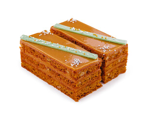 two slices walnut toffee cake on white