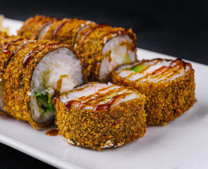 Warm tempura sushi rolls close up