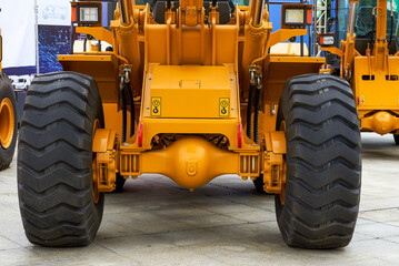 Close-up of tires of large industrial construction excavation equipment