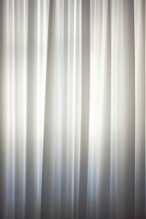 Black and white curtains with a light spot in the middle.