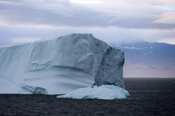 Icebergs under dramatic sky in Disko Bay, Arctic, Greenland, Denmark