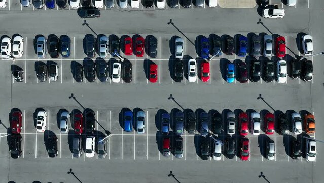Top down aerial view of parking lot. Cars parked in CarMax parking lot waiting to be sold.