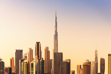 Dubai downtown skyline with modern skyscrapers at sunset. United Arab Emirates