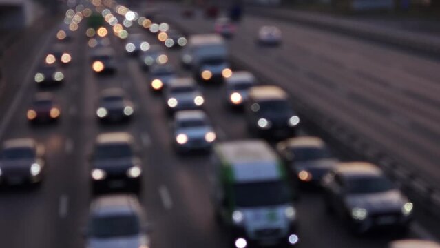 Evening city traffic with moving cars representing daily commute, urban mobility, and modern transportation background