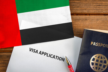 Fototapeta na wymiar Visa application form, passport and flag of United Arab Emirates 