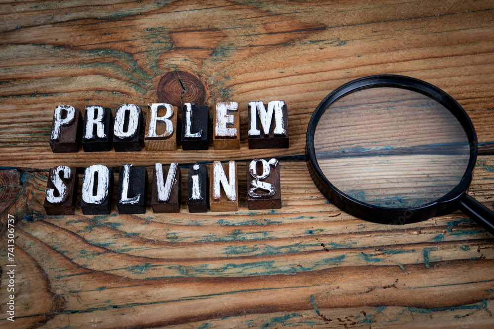 Wall mural problem solving. alphabet letters on wood texture background
