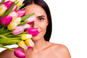 Obraz na płótnie Canvas Close-up portrait of her she nice cute pure adorable sweet attractive lovely cheerful dreamy brunette lady half face hiding behind early natural flowers isolated on pink background