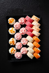 tasty sushi on the black background