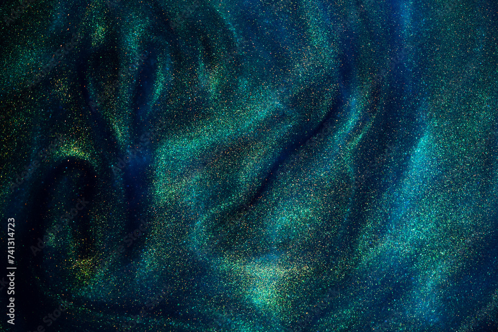 Canvas Prints bursting gold dust particles in blue liquid. abstract gold sparkling particles in blue fluid with gr