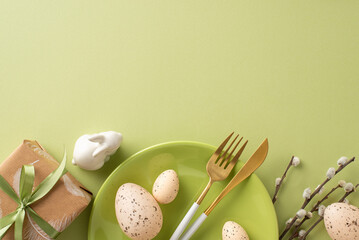 Charming Easter composition from top view, with natural gift wrapping, dining implements, bunny...