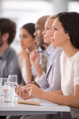 Meeting, presentation and audience of business people in office for teamwork, collaboration and discussion. Corporate, company and men and women writing notes for feedback, planning and report