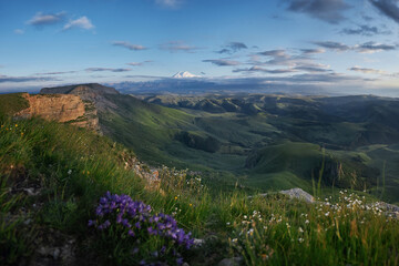 Caucasus mountains nature unveils its breathtaking beauty in every season. Vibrant wildflowers blooming in alpine meadows to majestic mountains towering against the azure sky