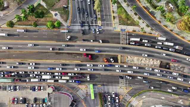 Rush hour traffic and traffic jam on highway bridge overpass. Aerial top-down