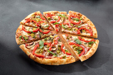 Meat lovers' pizza with bacon, ham, marinated pickles, and paprika, bursting with flavors and toppings