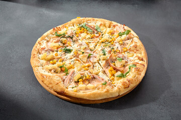 Hawaiian pizza with chicken, pineapple, and corn, a sweet and savory combination on a perfectly baked crust