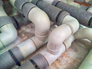Complex Network of Insulated Pipes in an Industrial Setting. maze of thermally insulated pipes...