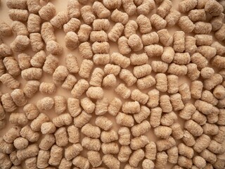 Background with scattered extruded bran
