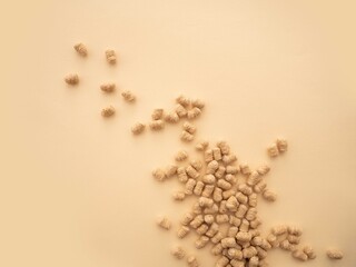 The extruded bran is scattered on a beige background. The concept of a healthy snack, weight loss...