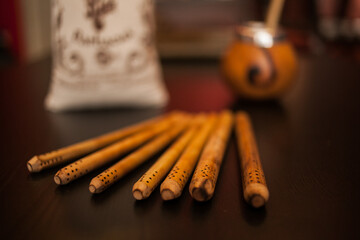 A collection of wooden sticks displayed on a table