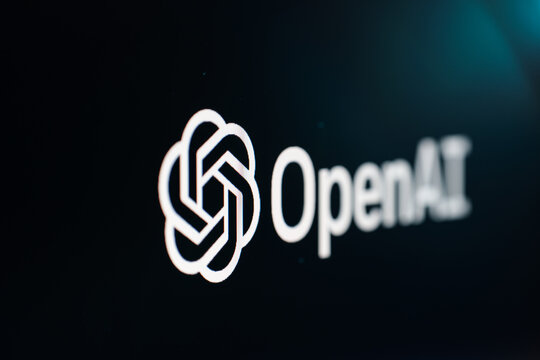 OpenAI logo on black background. OpenAI ChatGPT on PC screen