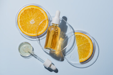 cosmetic laboratory experiment and research with orange and ingredient for natural beauty and organic skincare product. the blank bottle for label, bio science concept. alternative medicine. spa.
