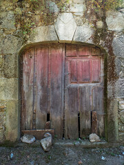 vertical photo of old wooden door of a home