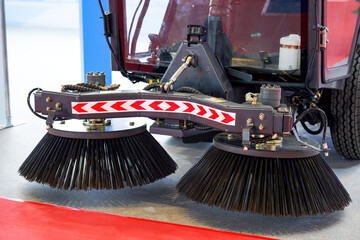 A brand new garbage sweeper truck on display in the showroom