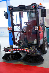 A brand new garbage sweeper truck on display in the showroom