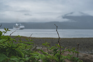Luxury cruiseship cruise ship liner Regatta anchored in Sitka Bay, Alaska on foggy low hanging...