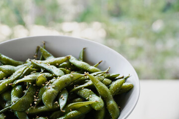 Barcelona, Spain; Februray 21 2024:Edamame salted green soybeans in bowl.
