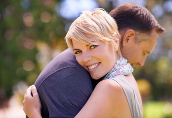 Hug, love and couple in nature with support, commitment and trust, care and solidarity while...