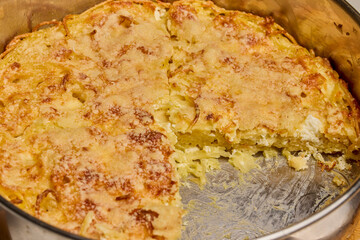 spaghetti with egg and parmesan cheese cooked in the oven, ready to eat.