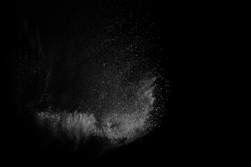 Abstract white dust on black background. Light smoke texture. Powder explosion. Splash water...