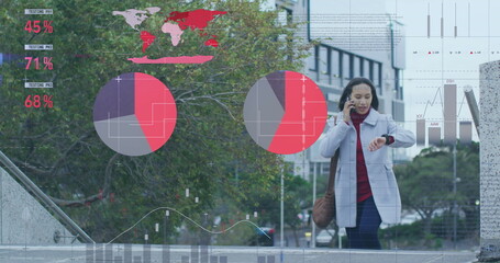 Image of data processing over biracial woman using smartphone