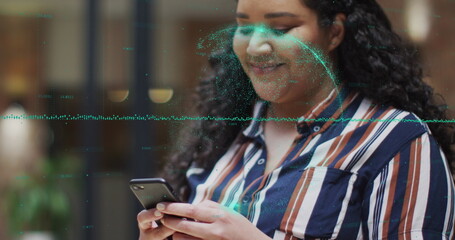 Image of data processing and globe over biracial woman using smartphone