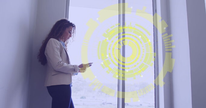 Image of data processing over biracial woman using smartphone