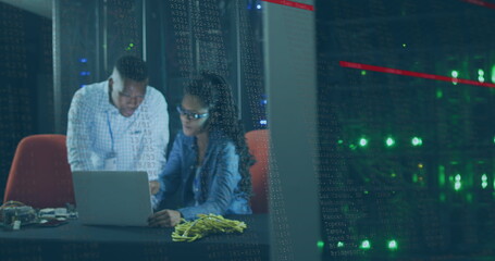 Image of data processing over african american couple server room workers using laptop