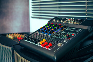 Close-up of sound recording equipment knobs.Mixer control. Music engineer. Backstage controls on an...