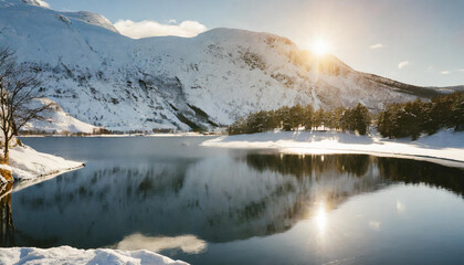 Sunlight Reflecting on Snow-Covered Lake with Mountains in the Background