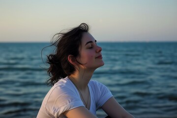 Fototapeta na wymiar sea background, sitting woman, eyes closed, peaceful