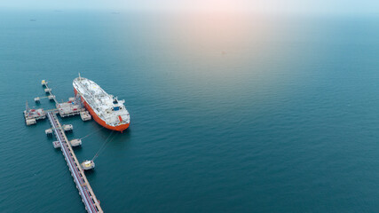 LPG ship, Oil tanker ship. Red Oil Tanker anchored in Gas terminal gas tanks for storage. petroleum...
