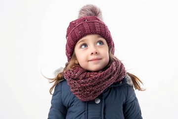 happy little girl dressed in a hat and winter clothes