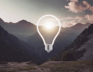 Conceptual image of light bulb over mountain, inspiration symbol - 741385767
