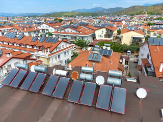 Close-up of photovoltaic solar panels from a drone on the roof of a country house. FETHIYE, Turkey....