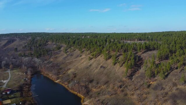 Autumn Overlook Aerial Views of Volga River, Forest, and the Grushinsky Festival Meadow in Warm Glow. Nature of Russia view from a drone in autumn