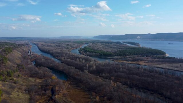 Autumn Overlook Aerial Views of Volga River, Forest, and the Grushinsky Festival Meadow in Warm Glow. Nature of Russia view from a drone in autumn