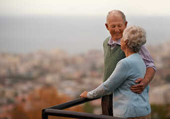 Love, marriage and senior couple on balcony of home together with view of nature for romantic getaway. Smile, anniversary or bonding with happy elderly man and woman outdoor on holiday or vacation