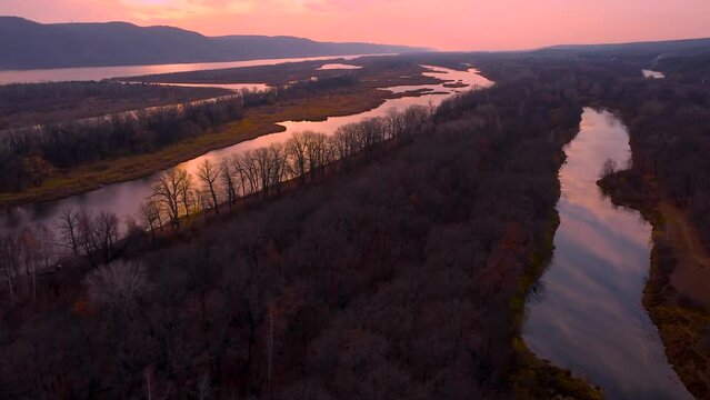 Autumn Overlook Aerial Views of Volga River, Forest, and the Grushinsky Festival Meadow in Warm Glow. Nature of Russia view from a drone in autumn
