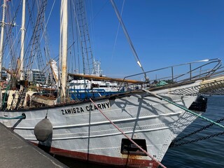 A large old sailing ship standing in the port.