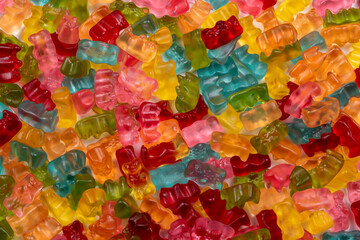 Fototapeta na wymiar Colorful Gummibears Texture Background: A Sweet Symphony of Flavors annd Colors